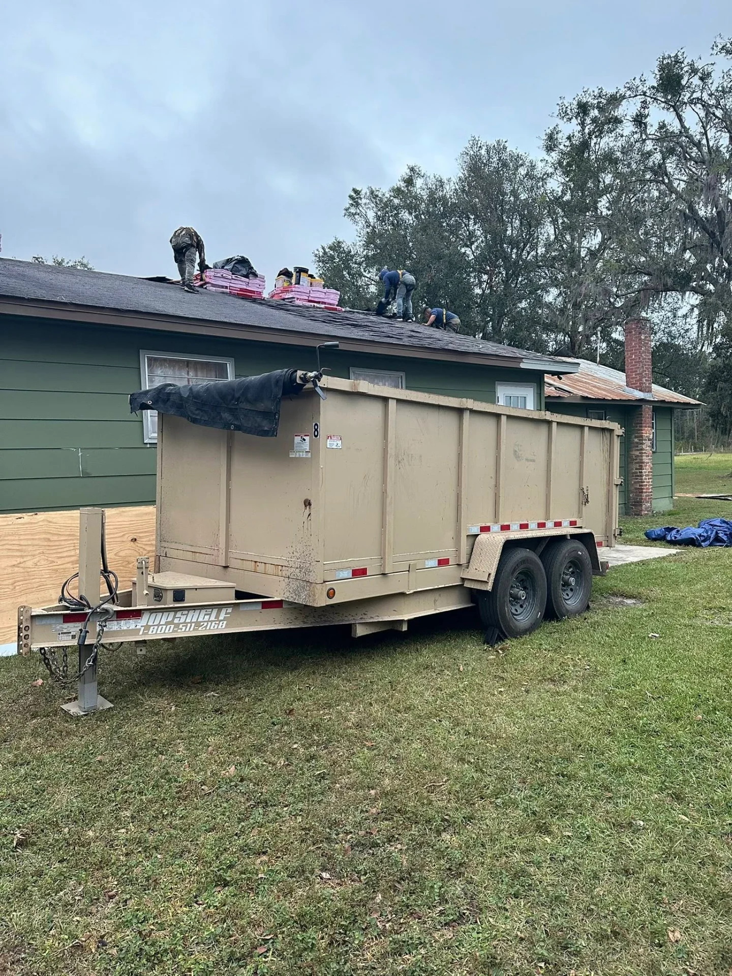 Dumpster rental at roofing job site